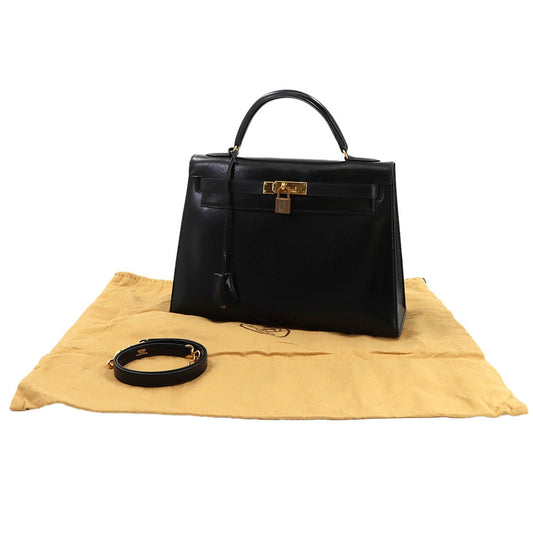Hermès Kelly 32 in Pelle Nera – Oro - Etoilux