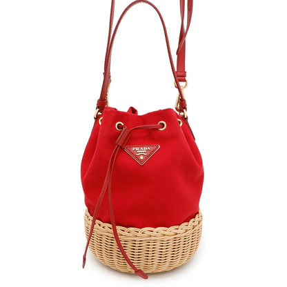Borsa Prada bucket in tela rossa e rattan intrecciato
