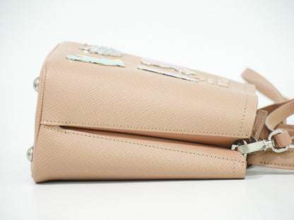 Prada Panier Bucket Bag in Saffiano Leather Beige – Limited Edition Pins - Etoilux