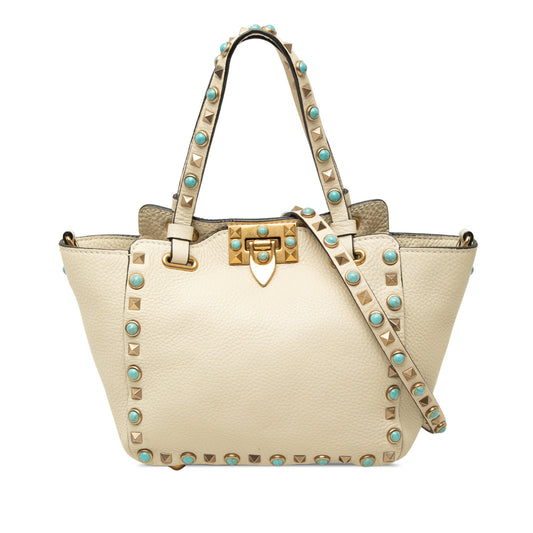 Borsa Valentino Garavani Rockstud Rolling mini tote in pelle martellata avorio con borchie dorate e cabochon turchese, vista frontale