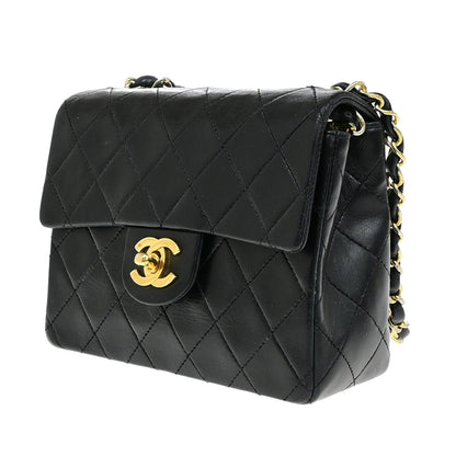 Chanel Vintage Mini Classic Flap Agnello Nero Hardware Oro – 17 cm - Etoilux
