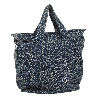 Chanel tote vintage grande tela stampata CC puntini bianchi blu navy anni 2000 con charm argentato e fodera logata