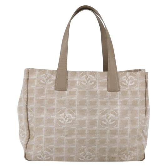 Chanel Travel Line Tote Medium nylon jacquard beige vista frontale, dettaglio hardware gold logo Chanel Paris, interno con patch Chanel Made in Italy, numero di serie 9390405