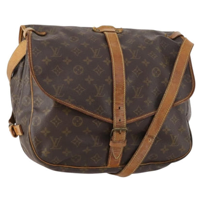 Louis Vuitton Saumur 35 monogram dettagli usura vachetta e fibbie vintage