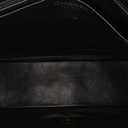 Chanel – Maxi Classic Chevron Patent Single Flap in pelle verniciata nera - Etoilux