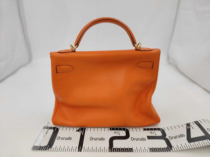 Hermès Kelly 32 Retourné Pelle Gulliver Arancione GHW 2000 – 32 cm - Etoilux