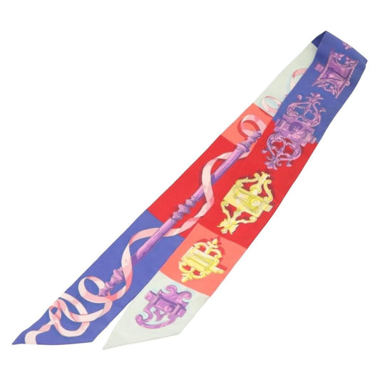 Hermès – Twilly in seta multicolore Un dettaglio iconico, pensato per chi conosce il linguaggio Hermès. - Etoilux