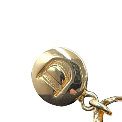 Dior — Orecchini pendenti placcati oro con charm borsa - Etoilux