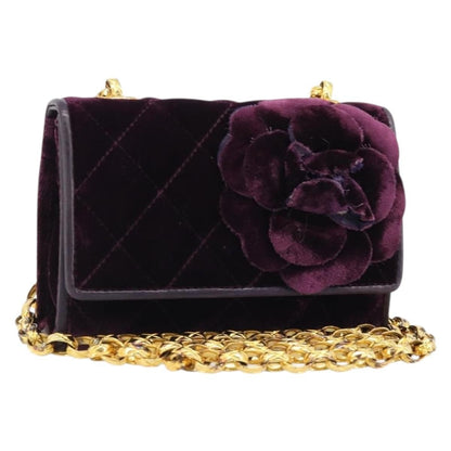 Chanel mini flap bag velluto viola prugna con camelia applicata vista frontale